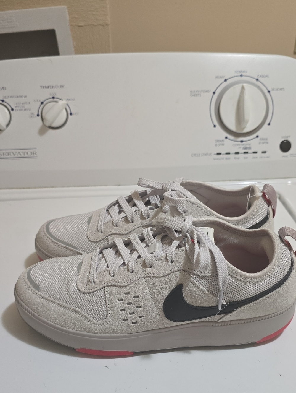 Nike Beige Low-Top Sneakers with Black Swoosh and Pink Accents